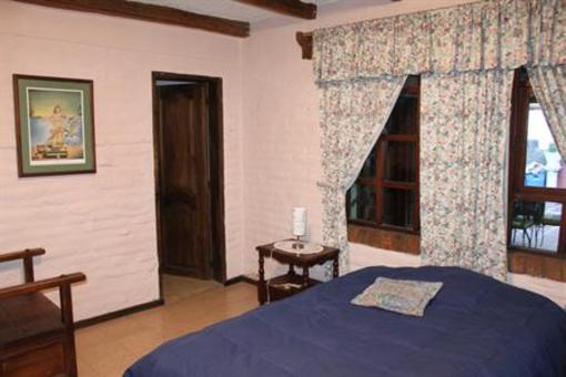 фото отеля Hostal Casa del Quinde