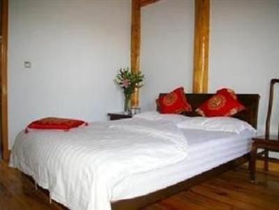 фото отеля Lijiang Shuanglongju Inn