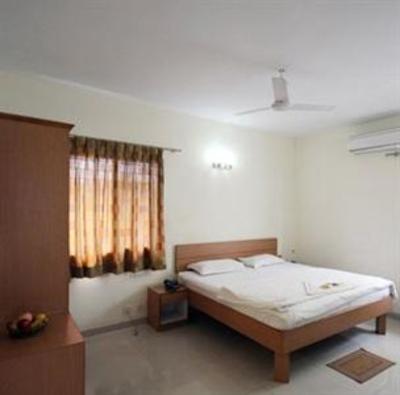 фото отеля Aranha Homes - Trinity Grand
