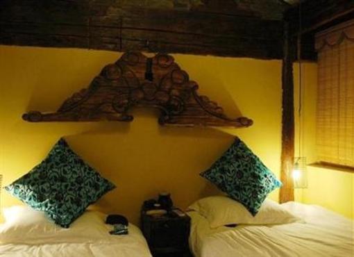 фото отеля Lijiang Beiweisanshidu Inn