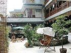 фото отеля Fenghuang County Garden Inn